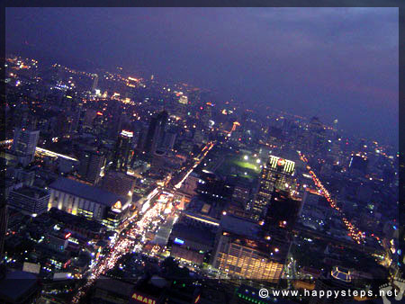 Photo of Bangkok’s cityscape at night, viewed from the Revolving Deck at the 84th Floor, Baiyoke Sky Hotel, Thailand