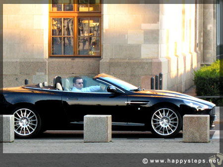 Photo of guy driving a flashy convertible along the Reichstag, Berlin