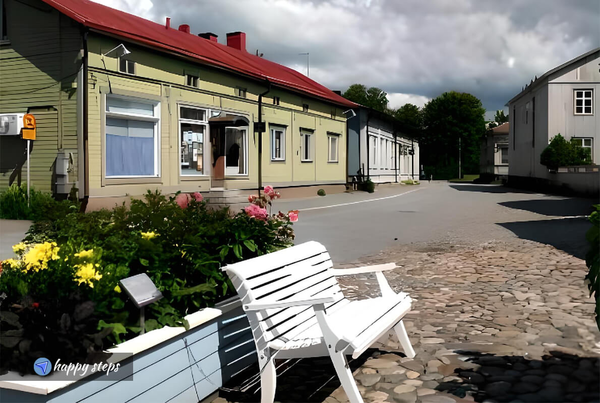 white bench in front of the Rauma Museum in Old Rauma, Finland