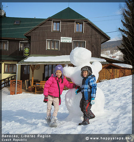 Making a snowman at Benecko in the Liberec Region of Czech Republic