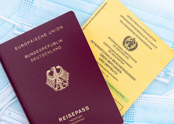 Travel during pandemic: Passport and vaccination certificate - Photo by Markus Winkler on Unsplash